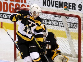 Kingston Frontenac Nathan Dunkley screens Sarnia Sting goalie Aidan Hughes during Ontario Hockey League action at the Rogers K-Rock Centre on Friday, Nov. 25, 2016 in Kingston, Ont. Hughes stopped 38 shots through 65 minutes and all three shootout attempts to grab his first win of the season. (Ian MacAlpine /The Whig-Standard)