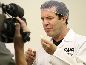 Tim Miller/The Intelligencer
Television personality Rick Mercer tries some cheese while recording a segment for his CBC show, The Rick Mercer Report. The segment, which was recorded in Belleville during the British Empire Cheese Show, is set to air this Tuesday.