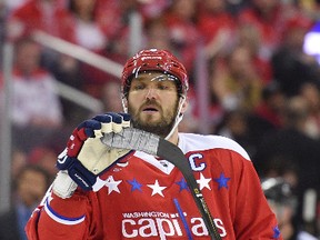 Washington Capitals left wing Alex Ovechkin, of Russia, examines his blade during the first period of an NHL hockey game against the Buffalo Sabres, Friday, Nov. 25, 2016, in Washington. (AP Photo/Nick Wass)