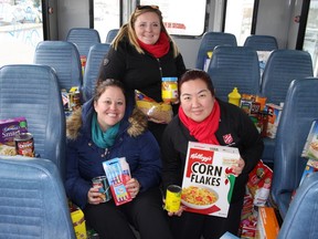 Food drive volunteers (from left) Heather Grosney, from Kingston Transit, with Keirsten McFie and Elizabeth Kim, both of the Salvation Army, at Grant’s No Frills  on Saturday, Nov. 26, 2016. Steph Crosier, The Whig-Standard, Postmedia Network