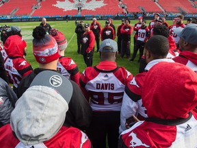 Calgary Stampeders head coach Dave Dickenson talks to his players during a walkthrough at the Western Conference practice, in Toronto on Saturday, November 26, 2016. The Ottawa Redblacks will play against the Calgary Stampeders Sunday in the 104th CFL Grey Cup.