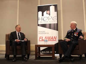 Wood Buffalo fire chief Darby Allen and CHED's Bruce Bowie at the Salvation Army’s Hope In The City Luncheon this week. The noon-hour gathering, with the Army’s band playing Christmas carols, was the official kick-off to the Christmas Kettle campaign. Supplied photo