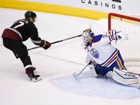 Arizona Coyotes right wing Radim Vrbata, left, scores against Edmonton Oilers goalie Cam Talbot during the shootout of an NHL hockey game Friday, Nov. 25, 2016, in Glendale, Ariz. The Coyotes won 3-2.