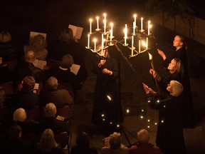 Candles are lit during the annual 'darkness to light' advent procession on November 25, 2016 in Salisbury, England.