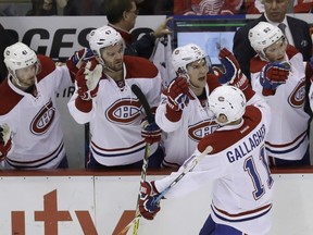 Montreal Canadiens right winger Brendan Gallagher (11) is congratulated by the bench after scoring during the third period of an NHL hockey game against the Detroit Red Wings on Nov. 26, 2016, in Detroit. (CARLOS OSORIO/AP)