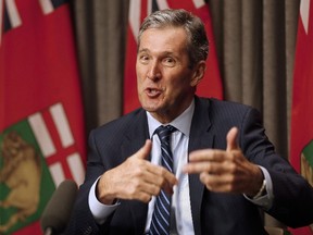 Manitoba Premier Brian Pallister speaks to media before the provincial throne speech at the Manitoba Legislature in Winnipeg, Monday, May 16, 2016. Pallister has been walking a fine line in the last week, saying he intends to bring in legislation next spring to control public-sector wage growth, but also refusing to release any details until he consults labour leaders. (THE CANADIAN PRESS/John Woods)