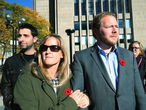 Fraud victims  Vicki Rowan and  James Davis leave a University Ave. courthouse earlier this month. Jonathan Rowe was found guilty of defrauding the couple and them and others of $2.5 million. (STAN BEHAL, Toronto Sun)