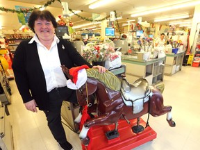 Store manager, Kathy Shore, stands with the mechanical horse, Peanut, in the IGA at Main Street and Jefferson Ave. on Thursday, Nov. 24, 2016. (Chris Procaylo/Winnipeg Sun/Postmedia Network)