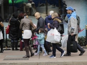 Shoppers are pictured in Toronto on Sunday. (ERNEST DOROSZUK, Toronto Sun)