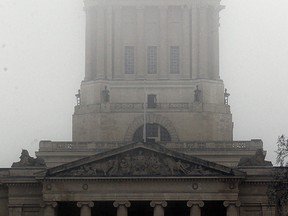 The dome of the Manitoba Legislative Building in Winnipeg, Man. is partially obscured by fog Sunday, Nov. 27, 2016. (Brian Donogh/Winnipeg Sun/Postmedia Network)