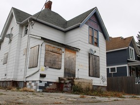 This boarded-up Wellington Street home, pictured here Friday, has landed a spot on the new Sarnia Blight website, an online community dedicated to addressing the issue of urban blight. The city's bylaw enforcement recently took action at this property, posting orders for the owners to deal with the weeds and graffiti. (Barbara Simpson/Sarnia Observer)