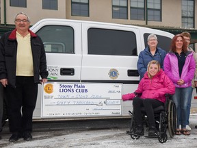 Members of the Stony Plain Lions Club hold a $60,000 cheque for the Town of Stony Plain so they could purchase a new HandiVan for the HandiBus Service, at the Town Office in Stony Plain on Monday, Nov. 21, 2016 - Photo by Yasmin Mayne.