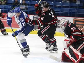 Niagara IceDogs Johnathon Schaefer keeps in close check as Sudbury Wolves Shane Bulitka tries to get a shot on   Niagara IceDogs goalie Colton Incze during OHL action from the Sudbury Community Arena in Sudbury, Ont. on Sunday November 27, 2016. Gino Donato/The Wolves defeated the IceDogs 6-4.Sudbury Star/Postmedia Network