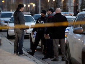 Toronto Police are pictured at the scene of a fatal shooting in a building at Munro St. (JOHN HANLEY PHOTO)
