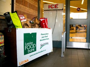 Donation boxes for The London Food Bank are found in many grocery stores like Metro near the exit. Local stores have pre-selected food bags available for purchase that make giving easier in London, Ont. Photograph taken on Sunday November 27, 2016. (MIKE HENSEN, The London Free Press)