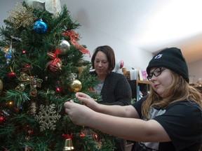 Rheanna Trepanier, is a 10-year-old girl with four brain tumours , and her mother Marissa Trepanier decorated their Christmas Tree. Rheanna has been given just a few months to live by doctors, so she has created a bucket list of things she would like to do on November 27, 2016.  Photo by Shaughn Butts / Postmedia