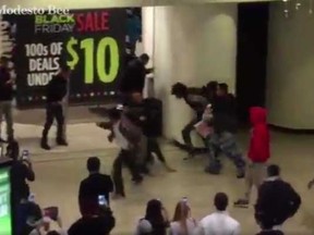 A brawl breaks out at a California mall on Black Friday. (Screengrab)