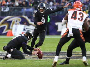 Justin Tucker of the Baltimore Ravens kicks one of his four field goals against the Cincinnati Bengals yesterday in Baltimore. (ROB CARR/Getty Images)