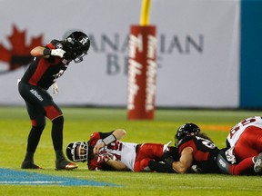Calgary quarterback Bo Levi Mitchell is sacked by the Ottawa defence at the Grey Cup. On the game, Mitchell said, “Too many mistakes were made, starting with me.”