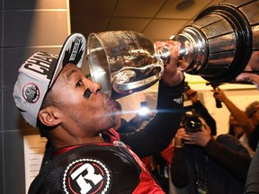 Ottawa Redblacks quarterback Henry Burris (1) takes a drink from the cup as the Redblacks celebrate their Grey Cup win.