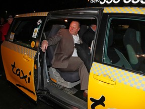 Gerard Gallant, former Florida Panthers head coach, gets into a cab after being relieved of his duties following an NHL game against the Carolina Hurricanes on Nov. 27, 2016, in Raleigh, N.C. (AP Photo/Karl B DeBlaker)