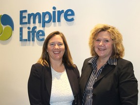 Empire Life's Laurie Swinton, left, and Julie Tompkins stand in the company's Kingston office. The company has long been a major donor to the annual United Way campaign. (Michael Lea/The Whig-Standard)