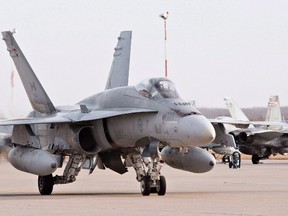 A pilot positions a CF-18 Hornet at the CFB Cold Lake, in Cold Lake, Alberta on Tuesday, October 21, 2014. The Canadian Forces says a CF-18 fighter jet has crashed in northeastern Alberta.A military spokesman said the plane was based out of Canadian Forces Base Cold Lake. (THE CANADIAN PRESS/Jason Franson)