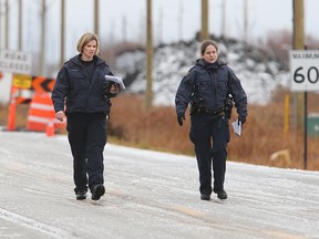 RCMP investigate on Raleigh Street Monday after two people were shot. (Brian Donogh/Winnipeg Sun)
