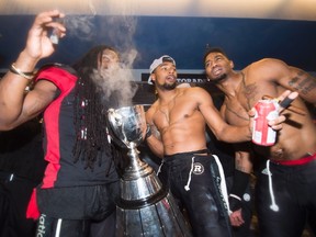 The Redblacks celebrate their Grey Cup win in Toronto on Sunday. (The Canadian Press)