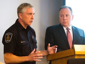 London Police Association head Rick Robson, left, seen here with police board member Paul Paolatto, says his members want a provincial watchdog to probe if Mayor Matt Brown impeded a potential budget deal early this year. (Free Press file photo)