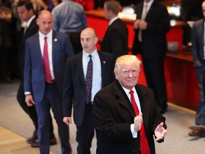 President-elect Donald Trump walks through the lobby of the New York Times following a meeting with editors at the paper on November 22, 2016 in New York City. (Photo by Spencer Platt/Getty Images)