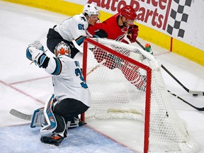 Carolina Hurricanes' Jordan Staal drives the puck behind San Jose Sharks goalie Aaron Dell while being chased by Justin Braun during an NHL game on Nov. 15, 2016, in Raleigh, N.C. (AP Photo/Karl B DeBlaker)
