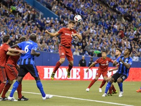 Toronto FC’s Nick Hagglund heads the ball during the opening leg of the MLS Eastern Conference final against the Impact at Olympic Stadium in Montreal. The series shifts to BMO Field on Wednesday with a berth in the MLS Cup final on the line. (GETTY IMAGES)