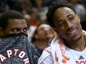 Kyle Lowry and DeMar DeRozan of the Toronto Raptors joke around on the bench against the Philadelphia 76ers during NBA Action at the Air Canada Centre in Toronto, Ont. on Monday November 28, 2016. (Dave Abel/Toronto Sun/Postmedia Network)
