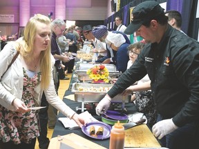 JP Mooney serves up his Brisket Egg Roll hors d'oeuvres Friday night at the annual Battle of the Hors D'oeuvres, a fundraiser for Big Brothers Big Sisters of Ingersoll, Tillsonburg and Area. Combined with Bid for Kids Sake, and generous sponsors, the event came close to reaching its $40,000 goal. (CHRIS ABBOTT/TILLSONBURG NEWS)