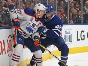 Connor McDavid of the Edmonton Oilers (left) battles against Nazem Kadri of the Toronto Maple Leafs on Nov. 1, 2016 in Toronto. (CLAUS ANDERSEN/Getty Images files)