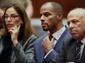 In this March 23, 2015, file photo, former NFL safety Darren Sharper, center, with his attorneys, Lisa Wayne, left, and Leonard Levine, right, appear in Los Angeles Superior Court. (AP Photo/Nick Ut, Pool, File)