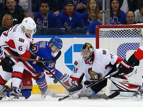 Ottawa Senators goaltender Craig Anderson makes a save during a game against the New York Rangers in New York on Nov. 27, 2016. (AP Photo/Rich Schultz)