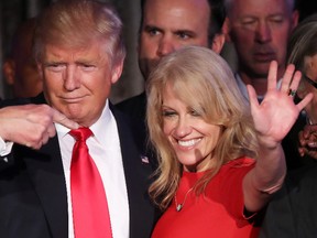 Republican president-elect Donald Trump along with his campaign manager Kellyanne Conway acknowledge the crowd during his election night event at the New York Hilton Midtown in the early morning hours of November 9, 2016 in New York City. 
Photo by Mark Wilson/Getty Images