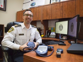 Dustin Carter, project lead of community medicine for the Middlesex-London Emergency Medical Services Authority, is heading a new program called Community Paramedicine Remote Patient Monitoring in London, Ont. on Tuesday November 29, 2016. Derek Ruttan/The London Free Press/Postmedia Network