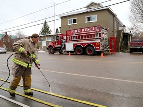 Leeds and the Thousand Islands Fire Department volunteer firefighter Angela MacDonald cleans fire hoses after a fire at the Seeley’s Bay Retirement Home, which is just across Main Street from the fire hall, was doused on Tuesday. (Ian MacAlpine/The Whig-Standard)