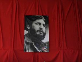 A photograph of the late Fidel Castro hangs at a memorial in his honor in Guanabacoa on the outskirts of Havana, Cuba, Monday, Nov. 28, 2016. Tribute sites are set up in hundreds of places across the country to bid farewell Castro, who died on Nov. 25 at age 90. (AP Photo/Natacha Pisarenko)