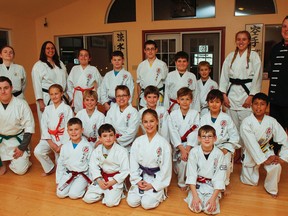 Students at Tallack Martial Arts, seen here in the dojo on Tuesday, raised more than $3,800 at the 21st annual Kids Helping Kids Have a Christmas event, which supports the Salvation Army’s Jerome Taylor Memorial/Whig-Standard Christmas Hampers for Hope Fund. (Julia McKay/The Whig-Standard)