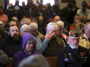 Mourners pack the Oregon Trail State Veterans Cemetery in Evansville, Wyo., on Tuesday morning, Nov. 29, 2016, for the funeral of Vietnam veteran Stephen Carl Reiman. Reiman died alone on Nov. 17 after traveling to Casper, Wyo., from Southern California for unknown reasons. Reiman had been homeless and suffering from PTSD. (Dan Cepeda/Casper Star-Tribune via AP)