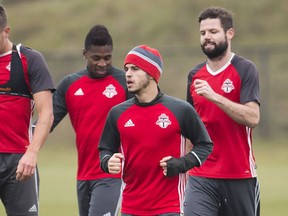 Toronto FC forward Sebastian Giovinco, front, warms up with teammates during practice ahead of the second leg of the MLS Eastern Conference final against the Montreal Impact in Toronto on Tuesday, November 29, 2016. (THE CANADIAN PRESS/Nathan Denette)