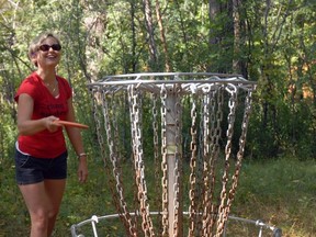 Shannon Springer prepares to take her shot during a match at earlier this fall St. Thomas' Waterworks Park disc golf course. St. Thomas Golf and Country Club is playing host to 76 pro and amataur players this weekend, its first foray into disc golf in the club's 120-year history.