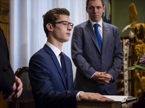 Nineteen-year-old Sam Oosterhoff is sworn in as the youngest-ever member of the Ontario legislature as Ontario PC Leader Patrick Brown, right, looks on in Toronto Wednesday, November 30, 2016. The Progressive Conservative was elected Nov. 17 in a byelection in Niagara West-Glanbrook, previously held by former party leader Tim Hudak. THE CANADIAN PRESS/Christopher Katsarov