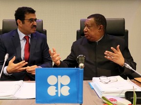 Mohammed Bin Saleh Al-Sada, Minister of Energy and Industry of Qatar and President of the OPEC Conference talks with Mohammad Sanusi Barkindo, from left, OPEC Secretary General of Nigeria prior to the start of a meeting of the Organization of the Petroleum Exporting Countries, OPEC, at their headquarters in Vienna, Austria, Wednesday, Nov. 30, 2016. (AP Photo/Ronald Zak)