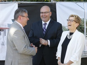 Premier Kathleen Wynne at the groundbreaking for the Laird Station on the Eglinton Crosstown project along with Metrolinx CEO Bruce McQuiag, and Transportation Minister Steven Del Duca, on June 30, 2016. (Michael Peake/Toronto Sun)