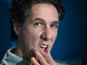 Montreal Impact head coach Mauro Biello ponders a question during a scrum prior to a practice on Nov. 29, 2016 in Montreal. (THE CANADIAN PRESS/Paul Chiasson)